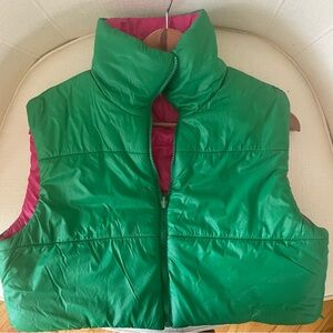 Green and pink vest. You can wear it reversible. Tag shows a bit, made for green